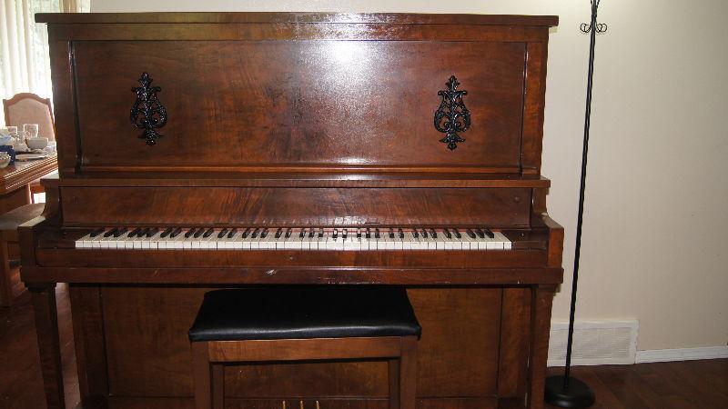 Upright piano with bench
