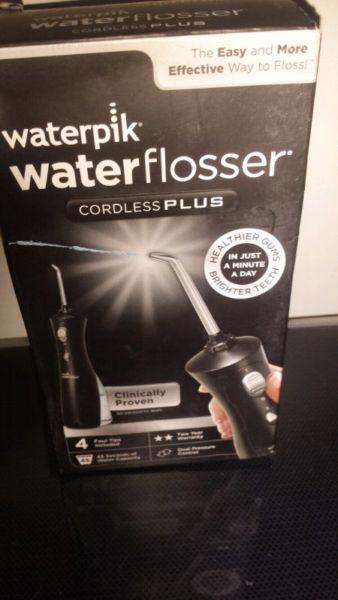 BRAND NEW WATER FLOSSER AND TOOTHBRUSH