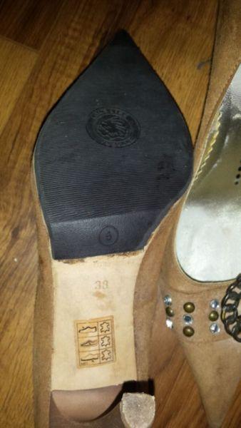 Pair of high heel shoes size 5