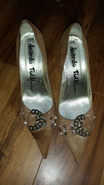 Pair of high heel shoes size 5