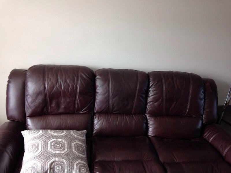 Leather reclining sofa. Excellent condition