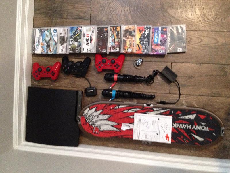 PS3 with 3 controllers, 10 games, Tony Hawk Board and sing star