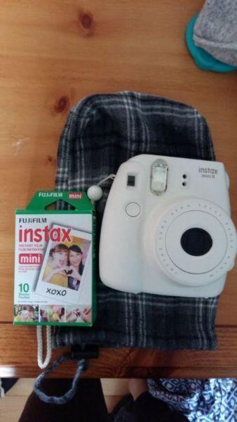 Instax mini with 2 things of film