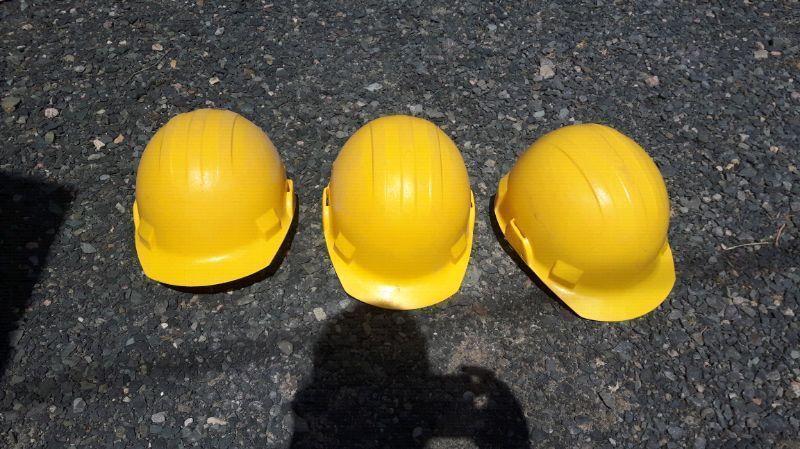 4 yellow hard hats