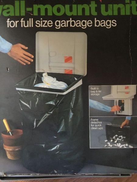 Garbage bag storage and holder