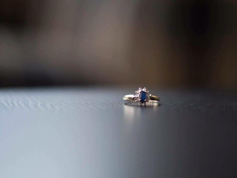 Oval blue sapphire with diamond halo, 10K gold ring. Size 6