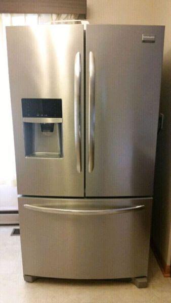 Save close to $3000! Fridge and stove 1 year old