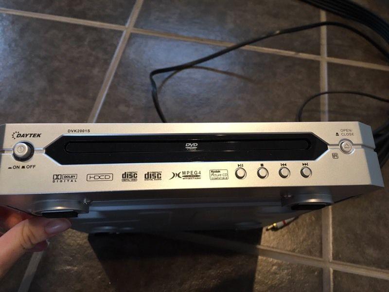 Small DVD player with cords to connect to tv