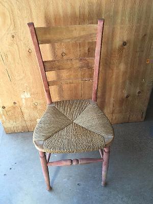 Antique chair with weaved seat