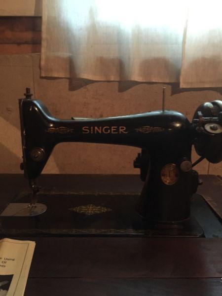 vintage Singer sewing machine in original cabinet