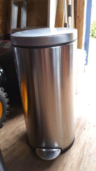 Two stainless steel garbage cans