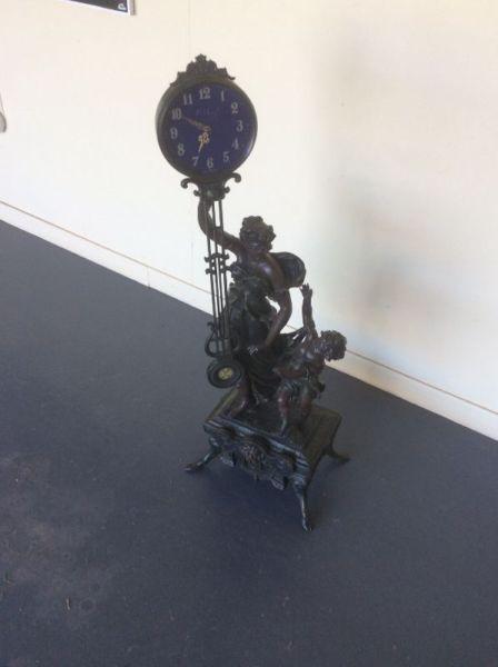 Ornamental Metal Statute Figure with Pendulum Clock