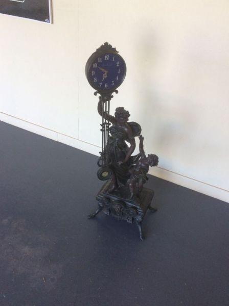 Ornamental Metal Statute Figure with Pendulum Clock