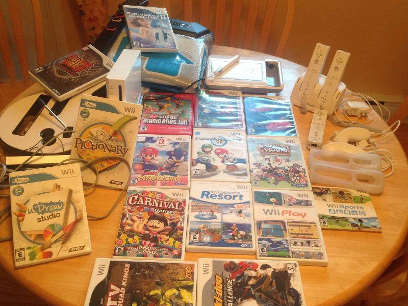 Console Wii avec plusieurs jeux et accessoires