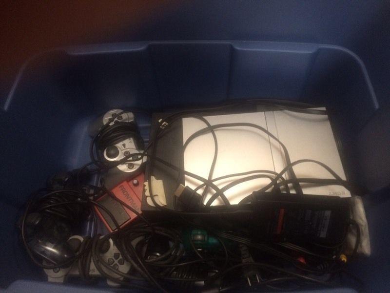 Two PS2 Consoles, 30 games & 5 Controllers