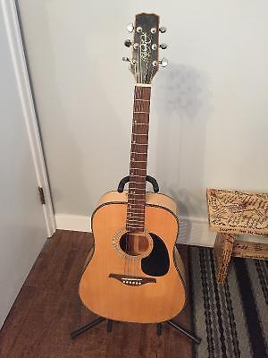 Acoustic Guitar and Case. Comes with Stand & Tuner