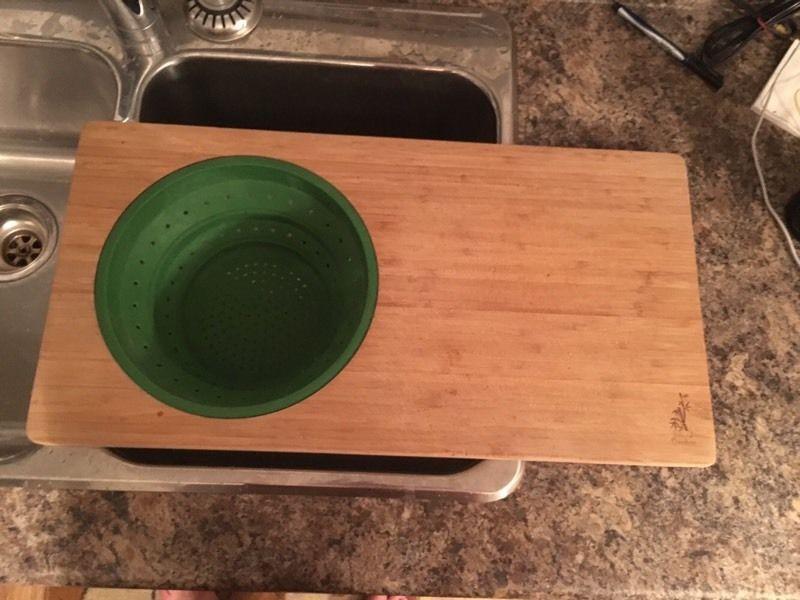 Bamboo cutting board with colander