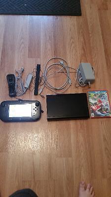 Wii U with extra controller and two games