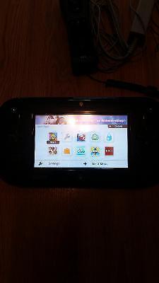 Wii U with extra controller and two games