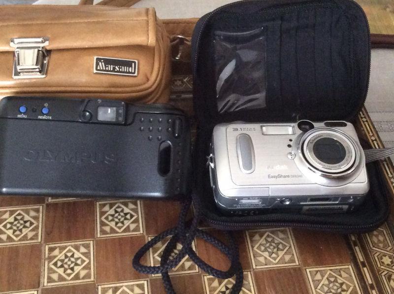 Two Vintage photo cameras ( Kodak and Olympus brands)