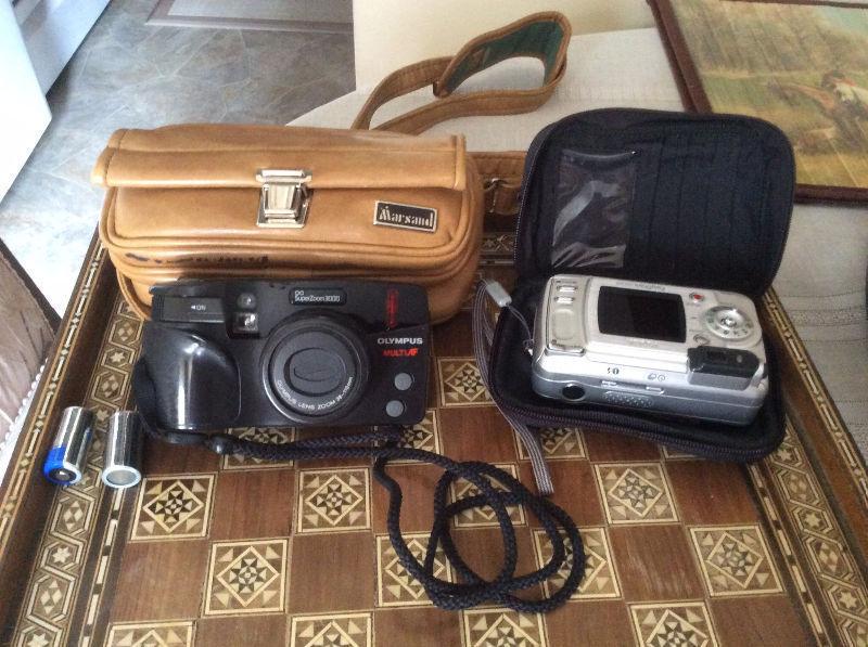 Two Vintage photo cameras ( Kodak and Olympus brands)