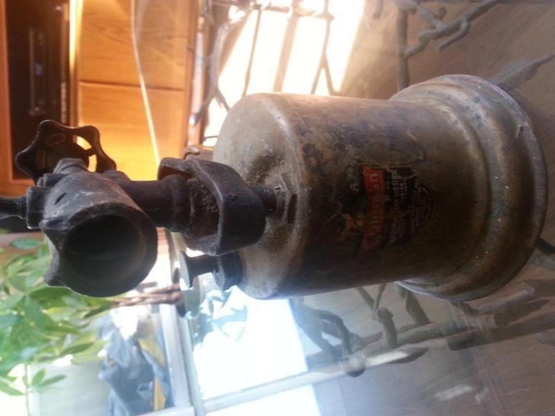 antique coleman torch/latern and a propane camping heater