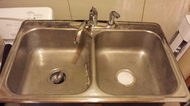 Double stainless steel kitchen sink and taps with sprayer