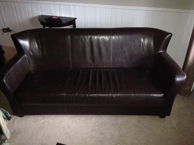 Dark chocolate/brown coloured couch - great condition