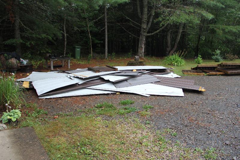 Large pile of used roofing metal