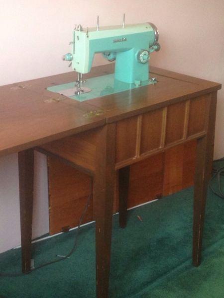 Sewing machine in table