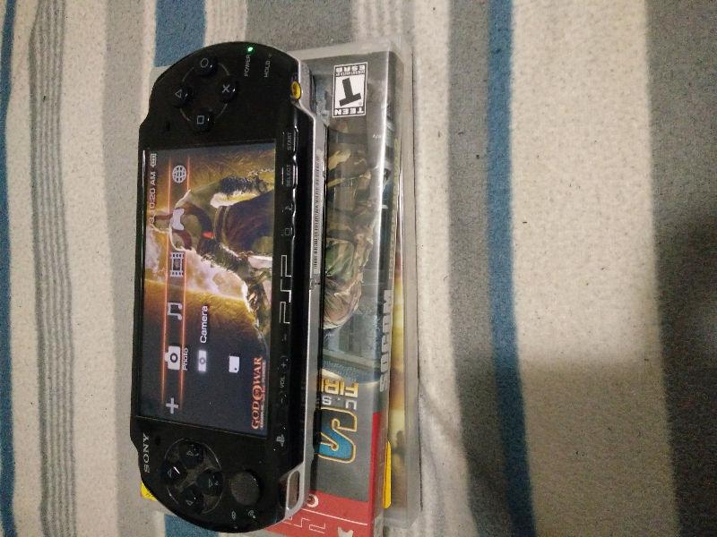 Black PSP 3001 with 2 games and wall charger