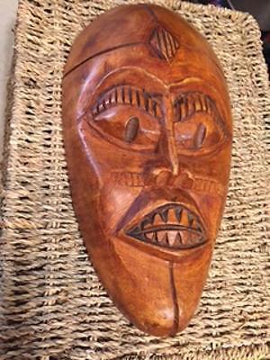 SIX HAND CARVED WOODEN AFRICAN MASKS