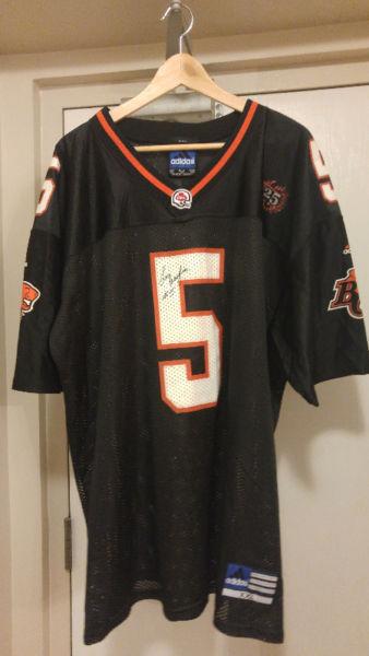 BC LIONS LUI PASSAGLIA 25 YEAR SIGNED JERSEY AND BALL