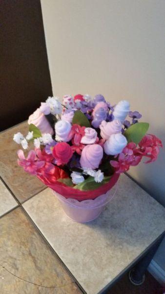 Diaper cakes and flower arrangements