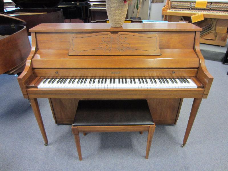 Great deal! Kimball console piano with a pecan finish!