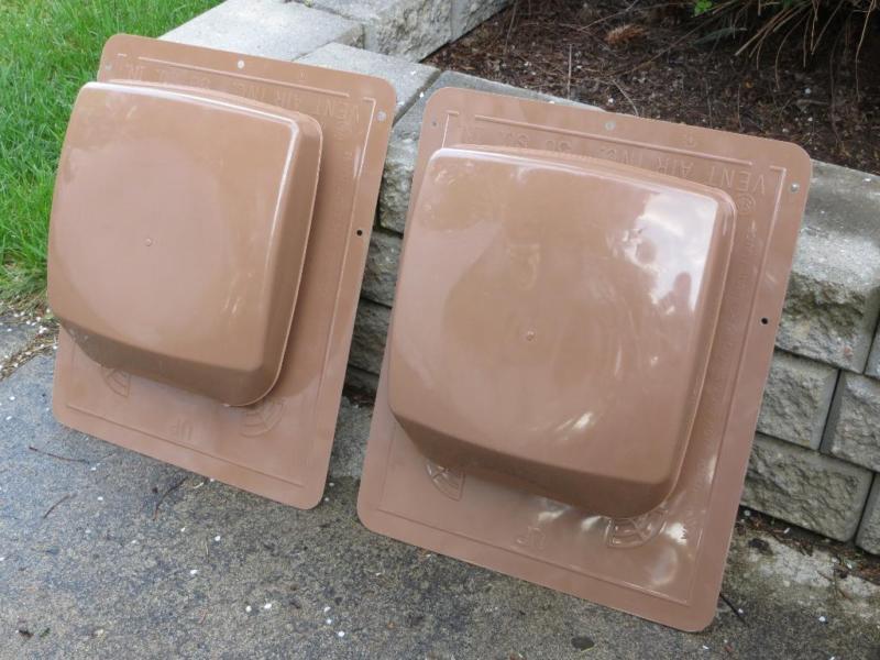 Two brown plastic Roofing vents