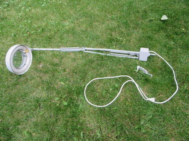 lighted magnifier with swing arm