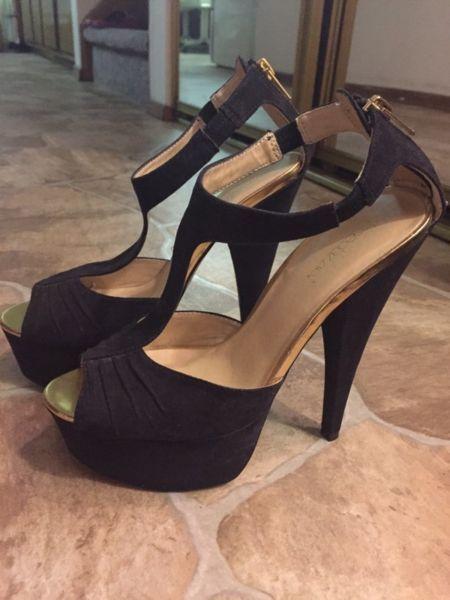 Black heels with gold trimming size 7.5