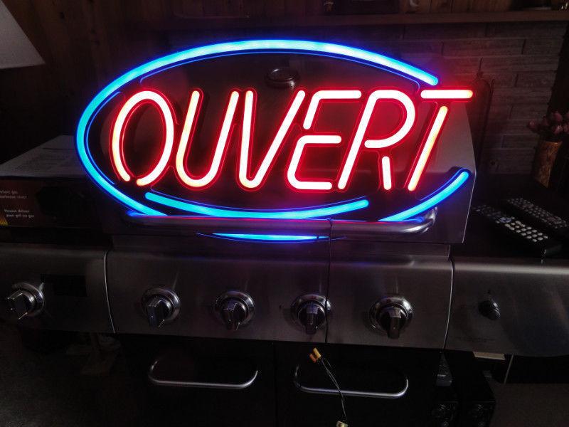 Lighted OUVERT sign OPEN