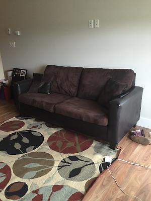 Brown couch with some leather