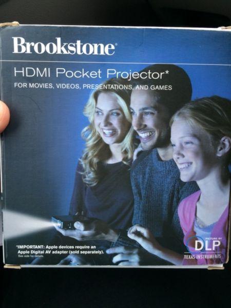 Wanted: Brookstone Pocket Projector- used