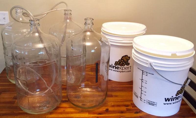 4 Carboys and 4 buckets for wine making