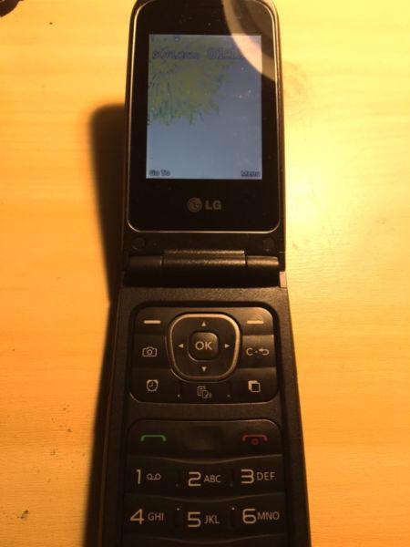 SOLD LG flip cell phone with Telus or koodo