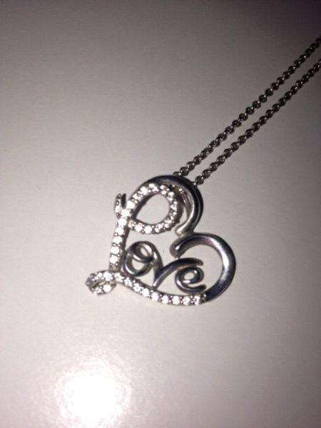 Heart Necklace that says Love