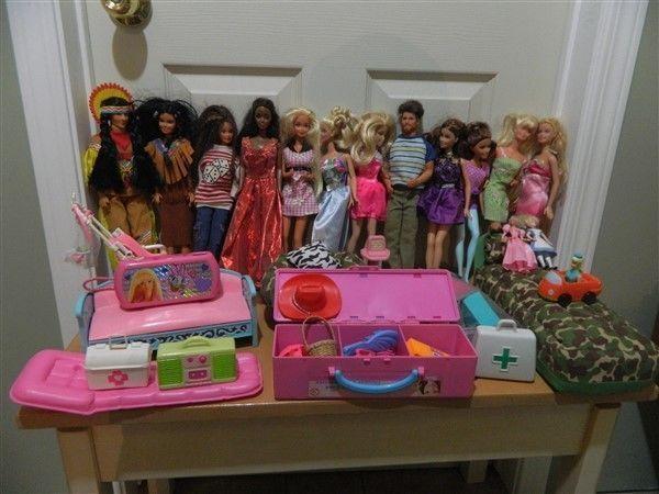 12 Barbie Dolls, house & Accessories (over 50 pieces)