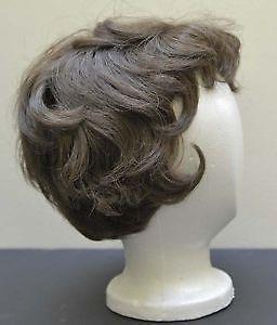 Never-worn woman's brown wig with stylish short gentle curls