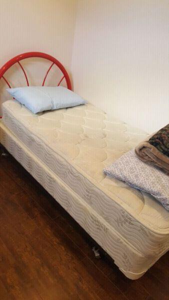 A single bed frame, headboard, box and mattress for sale