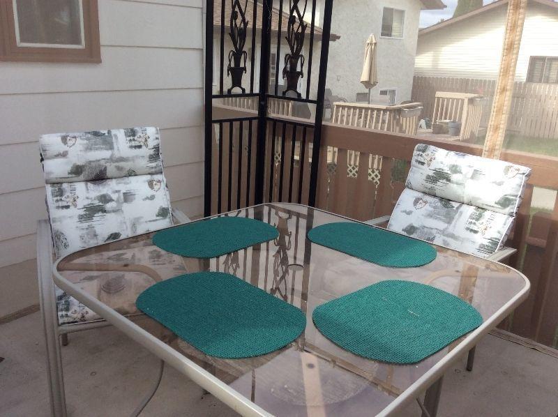 Patio Table and 4 chairs with cushion covers