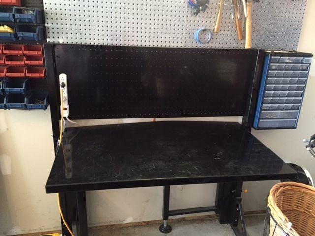 Folding Workbench with peg board and small bins