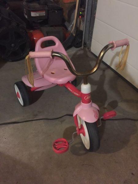 Little girls pedal tricycle